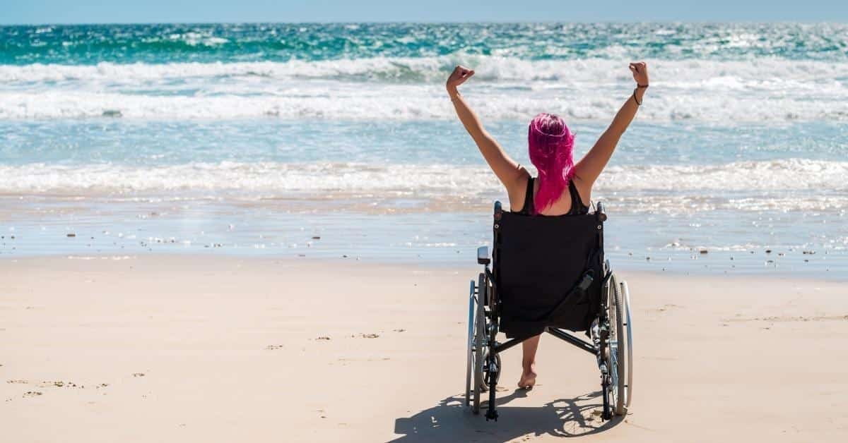 disable woman at the beach